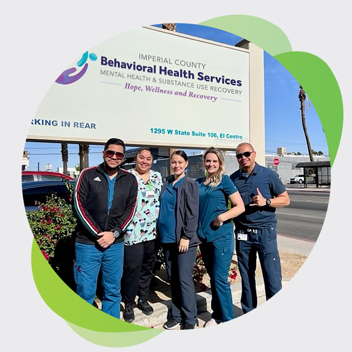 BHS team at the building sign